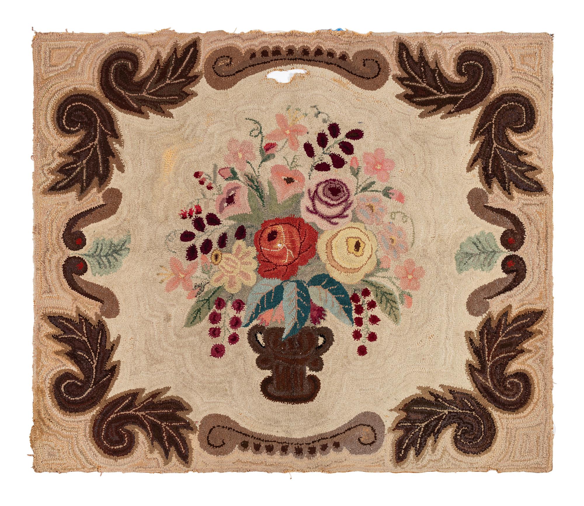 A Cotton Floral Urn and Brown Acanthus Leaf Decorated Hooked Rug