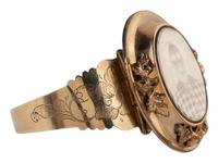 [EARLY PHOTOGRAPHY]. Daguerreian "sweetheart" 10K gold cuff containing portrait of young woman.