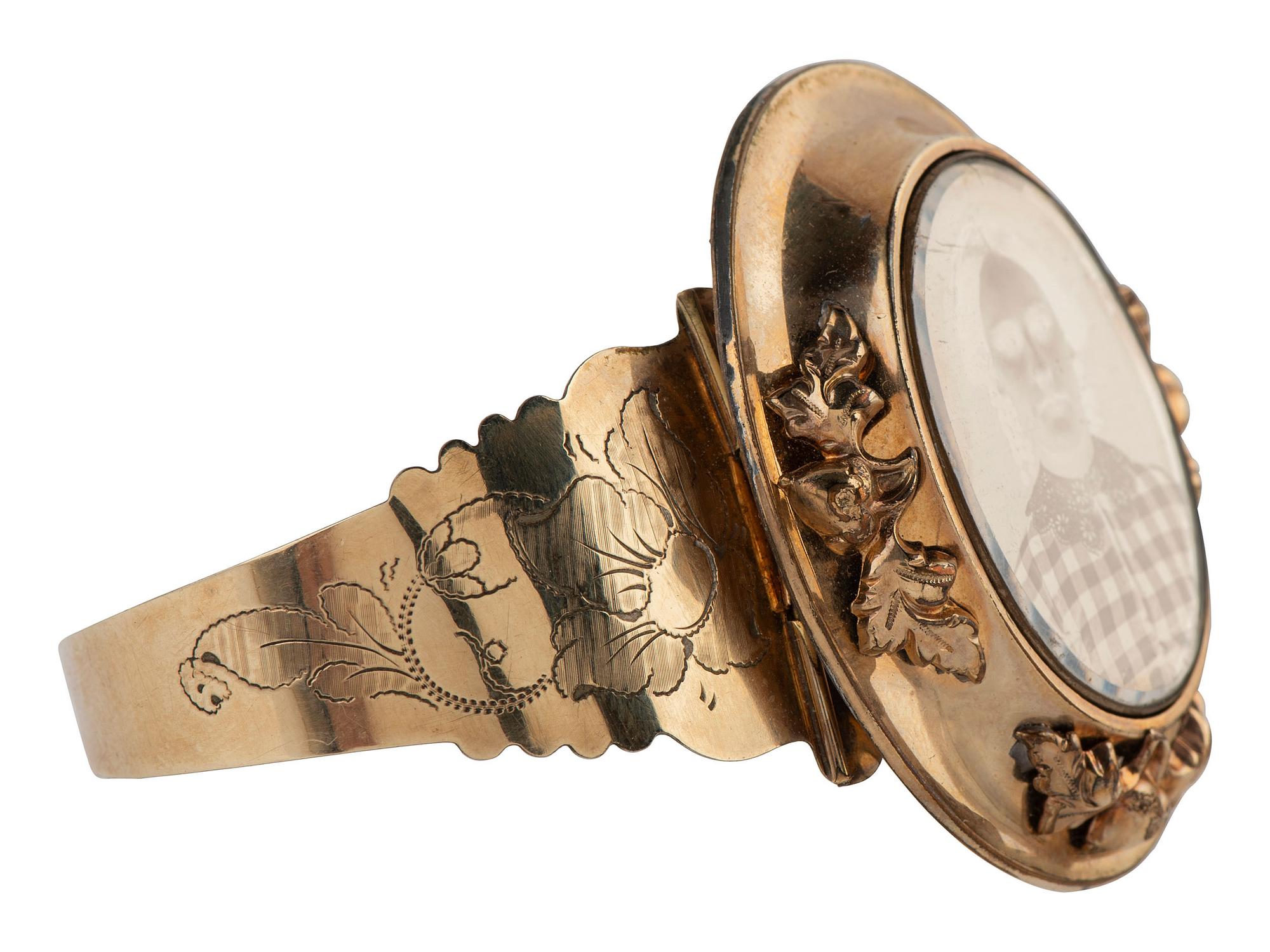 [EARLY PHOTOGRAPHY]. Daguerreian "sweetheart" 10K gold cuff containing portrait of young woman.