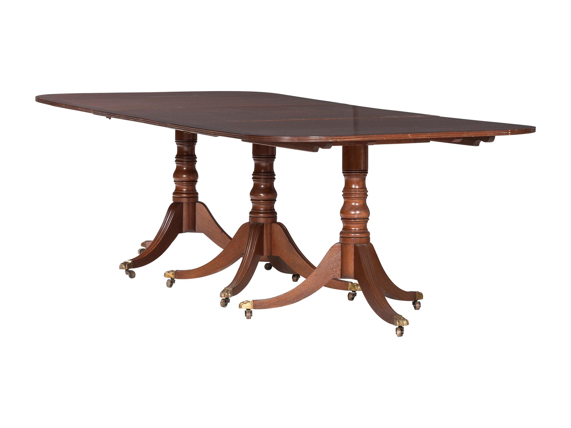 An Irish Regency Mahogany Triple Pedestal Dining Table