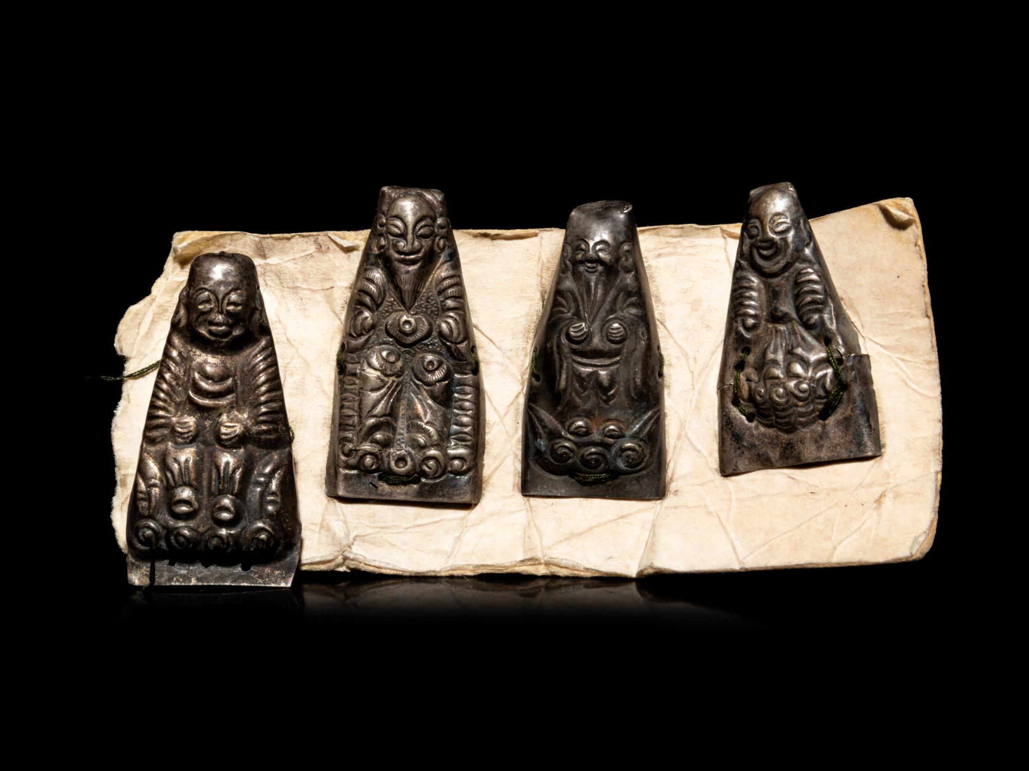 Nine Small Southeast Asian Silver Buddhist Votives