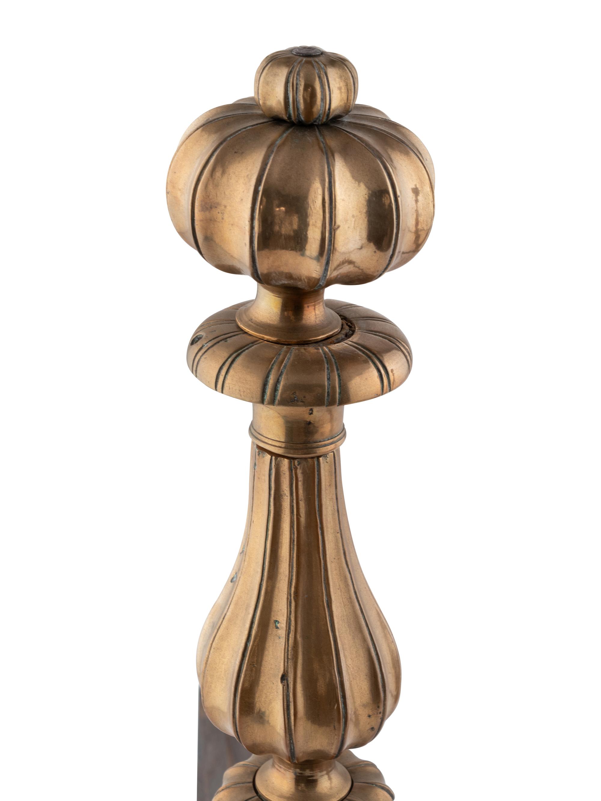 A Pair of Continental Brass and Steel Andirons