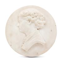 A Continental Carved Marble Profile Medallion