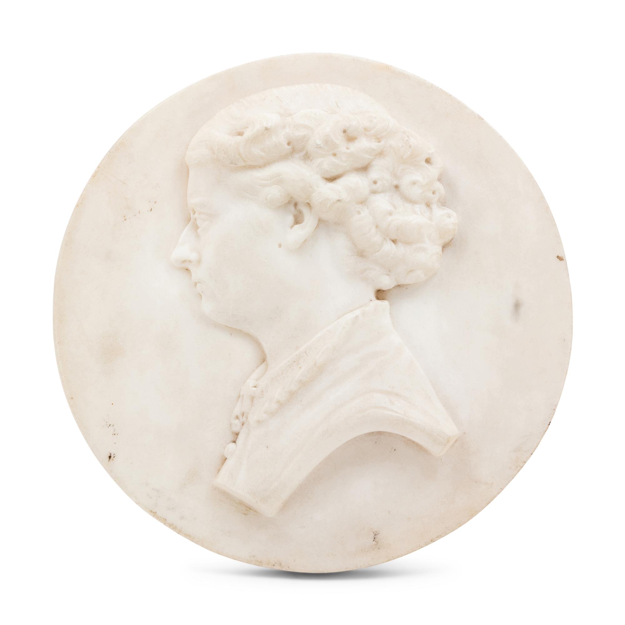 A Continental Carved Marble Profile Medallion