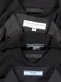 Twelve Designer Button Down Tops: One Carolina Herrera, One Vince, One Lanvin, Two Hermès, Three Prada, and Four The Row