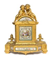 A Gilt Bronze and Sevres Style Porcelain Mantel Clock, Height 14 1/4 inches.