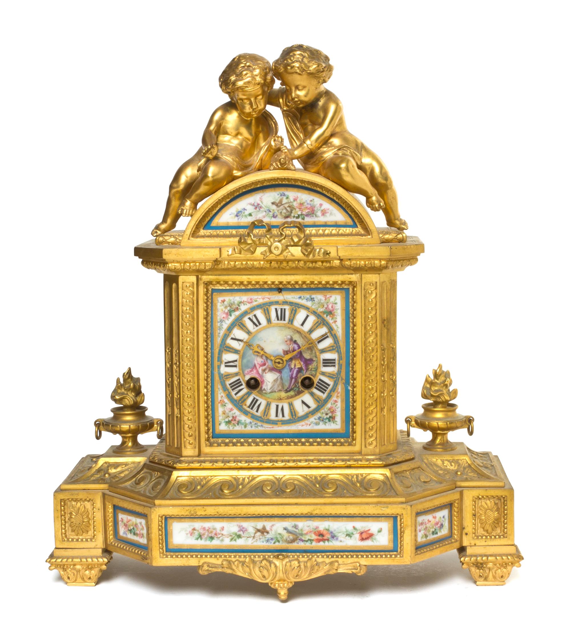 A Gilt Bronze and Sevres Style Porcelain Mantel Clock, Height 14 1/4 inches.