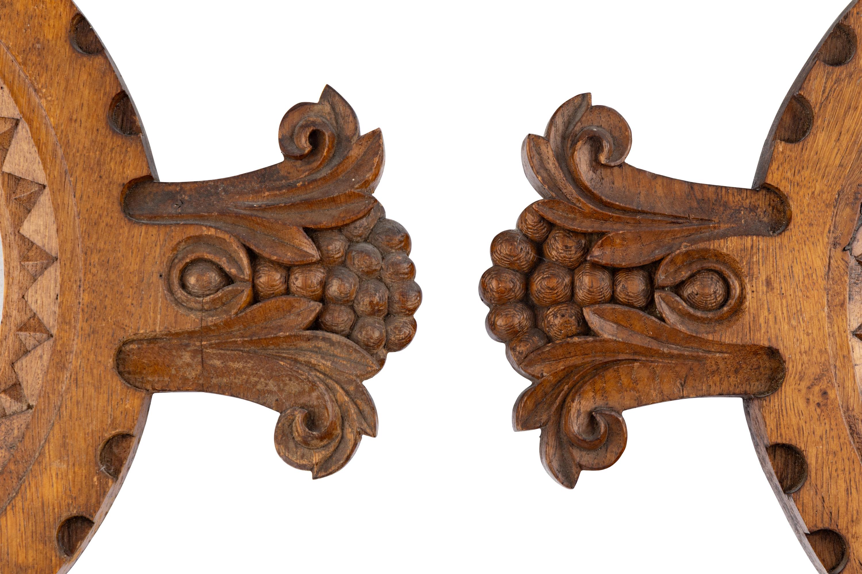 A Group of Three Renaissance Revival Oak Mirrors