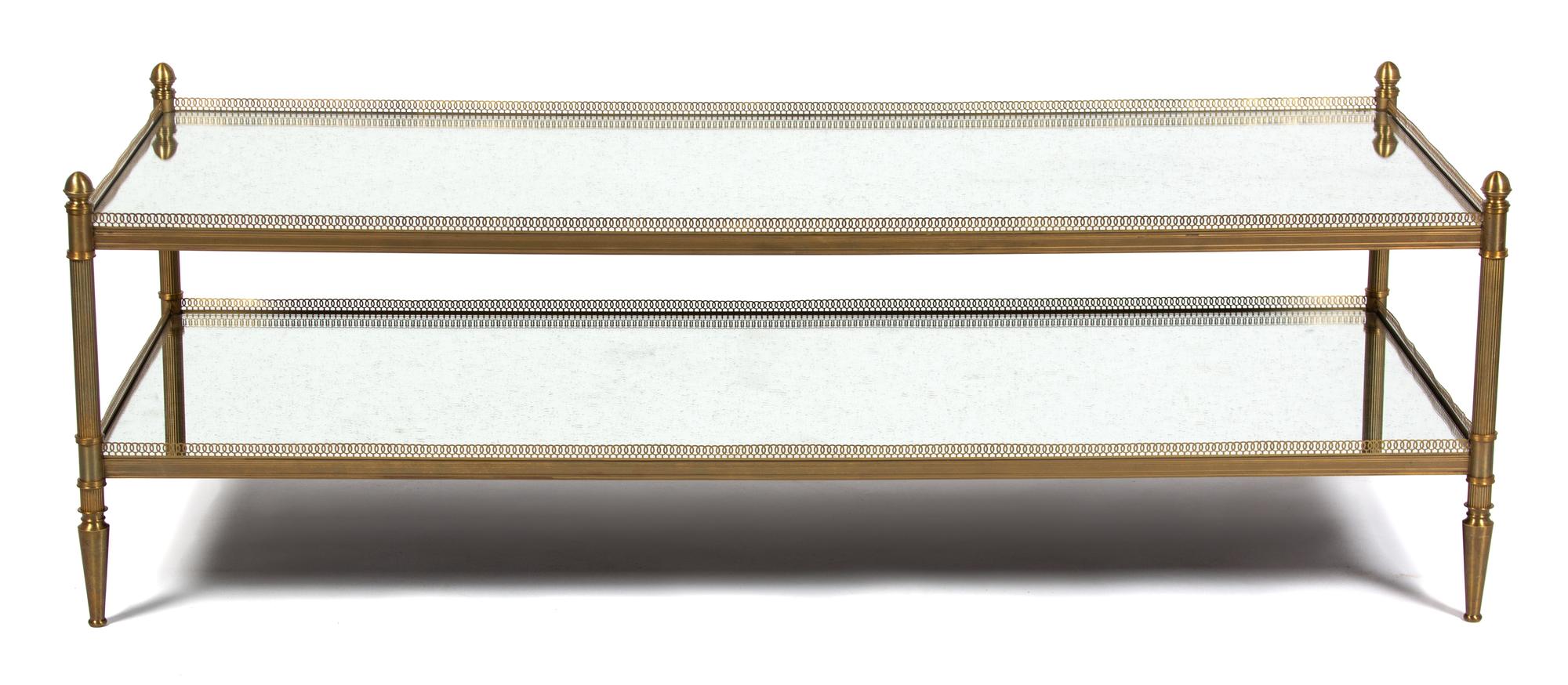 A Brass and Mirrored Glass Coffee Table Height 18 x width 60 x depth 24 inches. — 20TH CENTURY