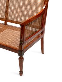 An Edwardian Painted Satinwood Caned Settee