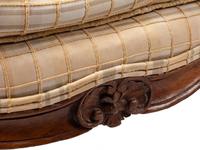 A Pair of Louis XV Provincial Walnut Fauteuils