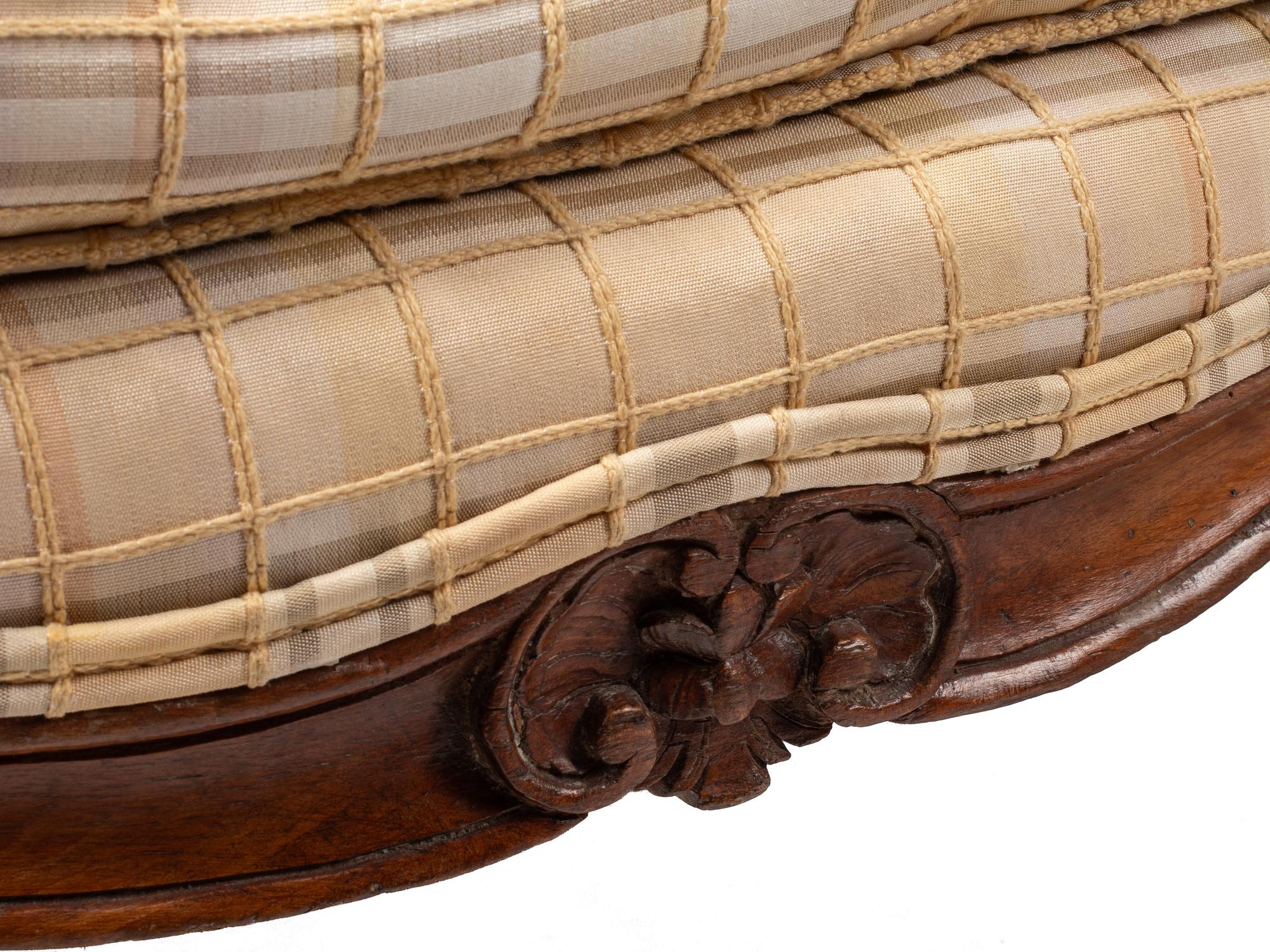 A Pair of Louis XV Provincial Walnut Fauteuils