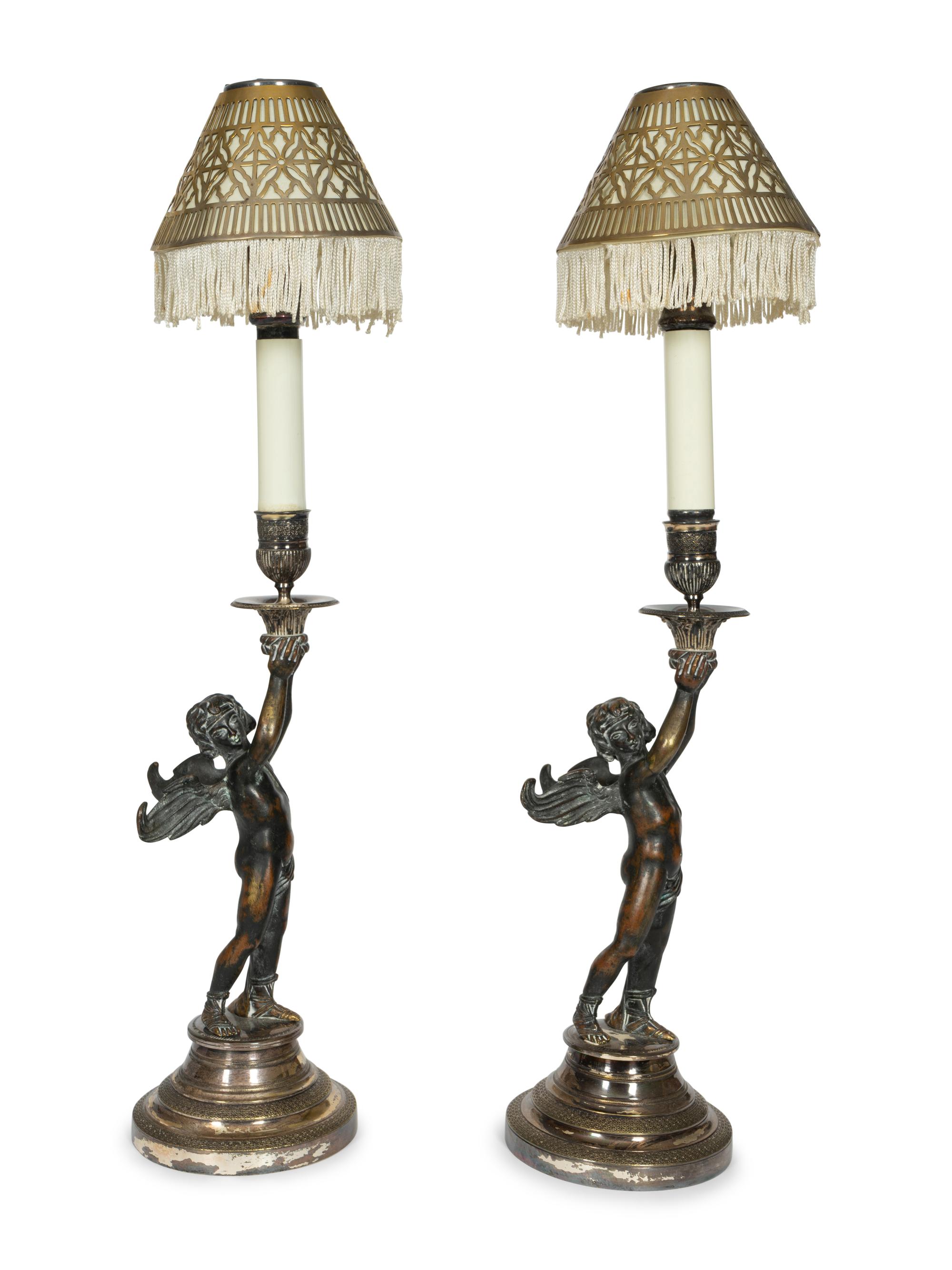 A Pair of Continental Patinated Bronze and Silver-Plate Candlesticks