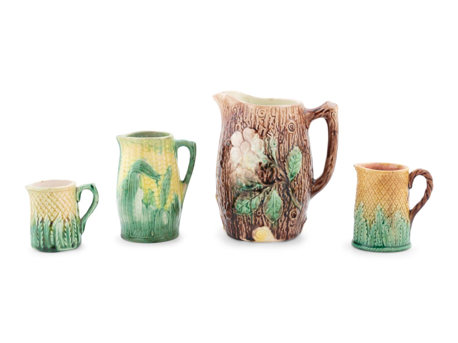 A Group of Nine Majolica Pitchers
