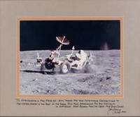 YOUNG, John Watts (1930-2018). Photograph of Young driving a moon buggy, signed (“John Young”) to Ambassador Edward Joseph Perkins.