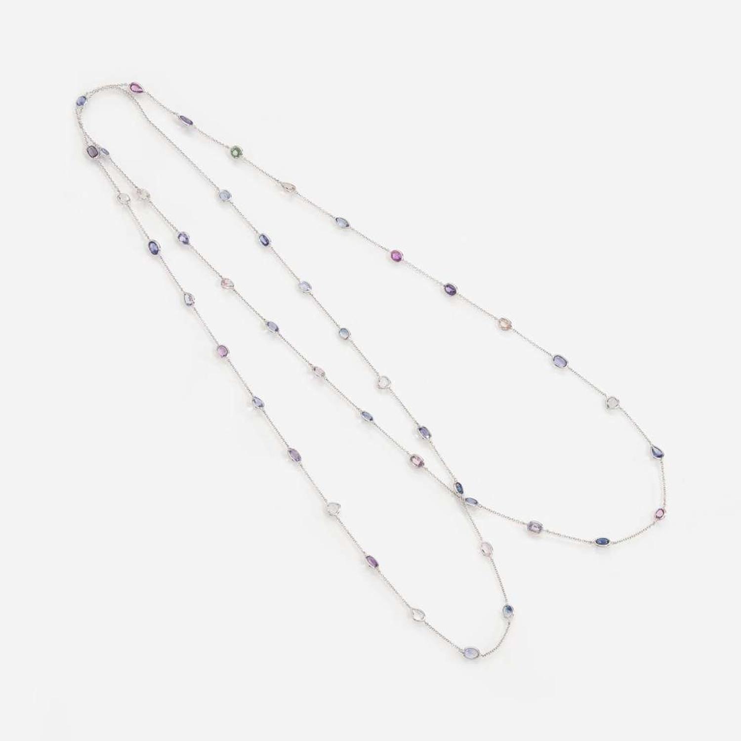 An 18 Karat White Gold Sapphire Station Necklace