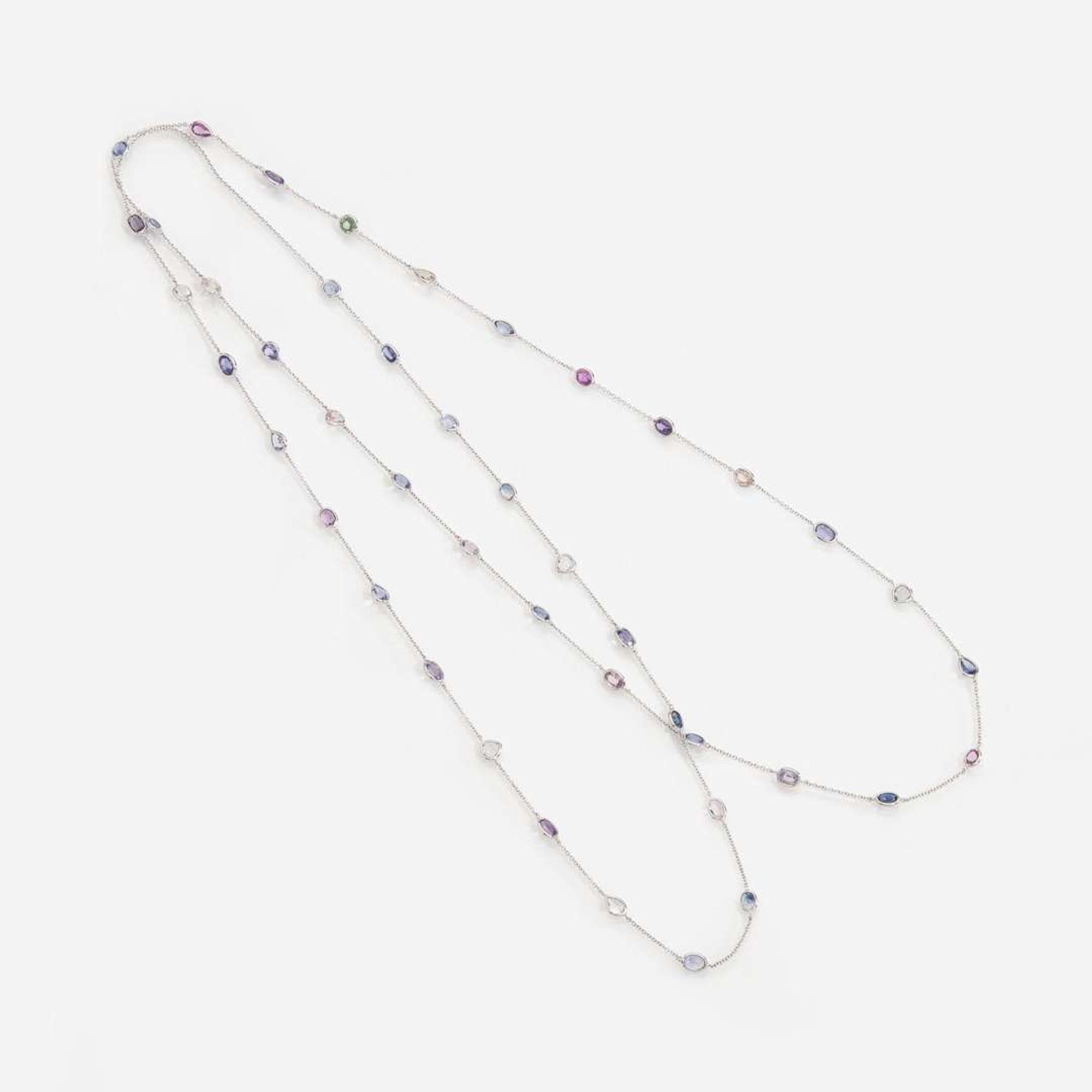 An 18 Karat White Gold Sapphire Station Necklace