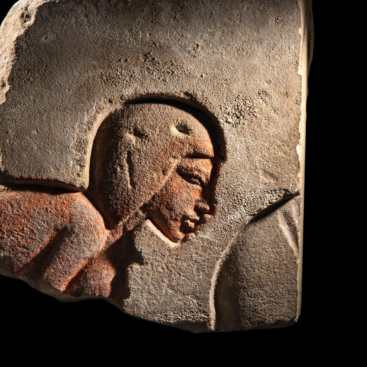 An Egyptian Sandstone Relief Fragment with a Worshipper