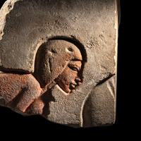 An Egyptian Sandstone Relief Fragment with a Worshipper