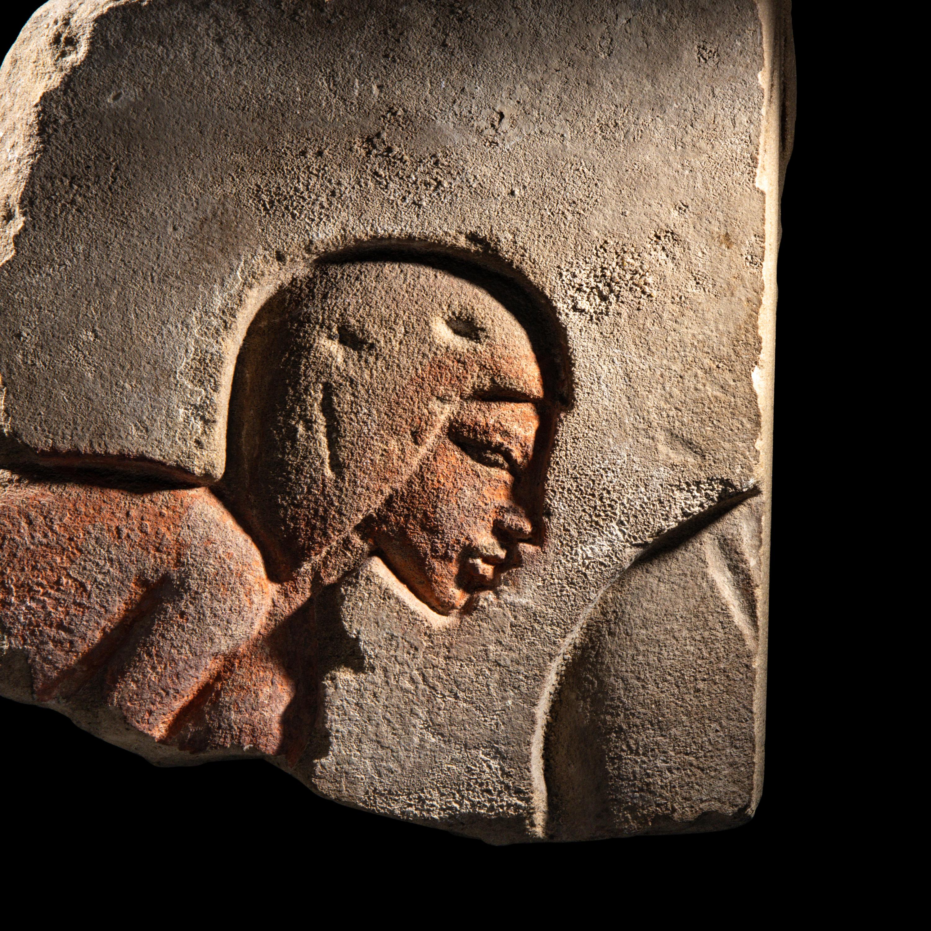 An Egyptian Sandstone Relief Fragment with a Worshipper