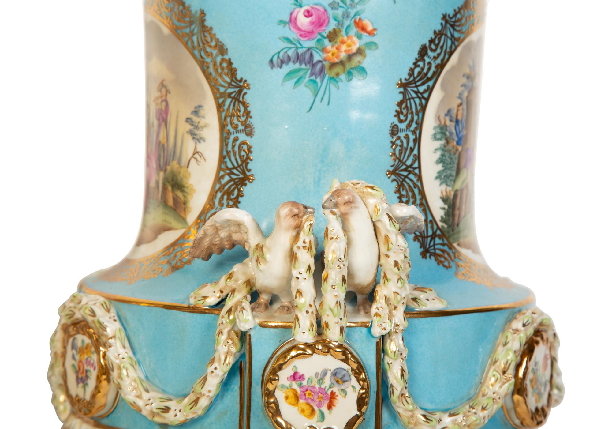 A Pair of Sèvres Style Porcelain Urns