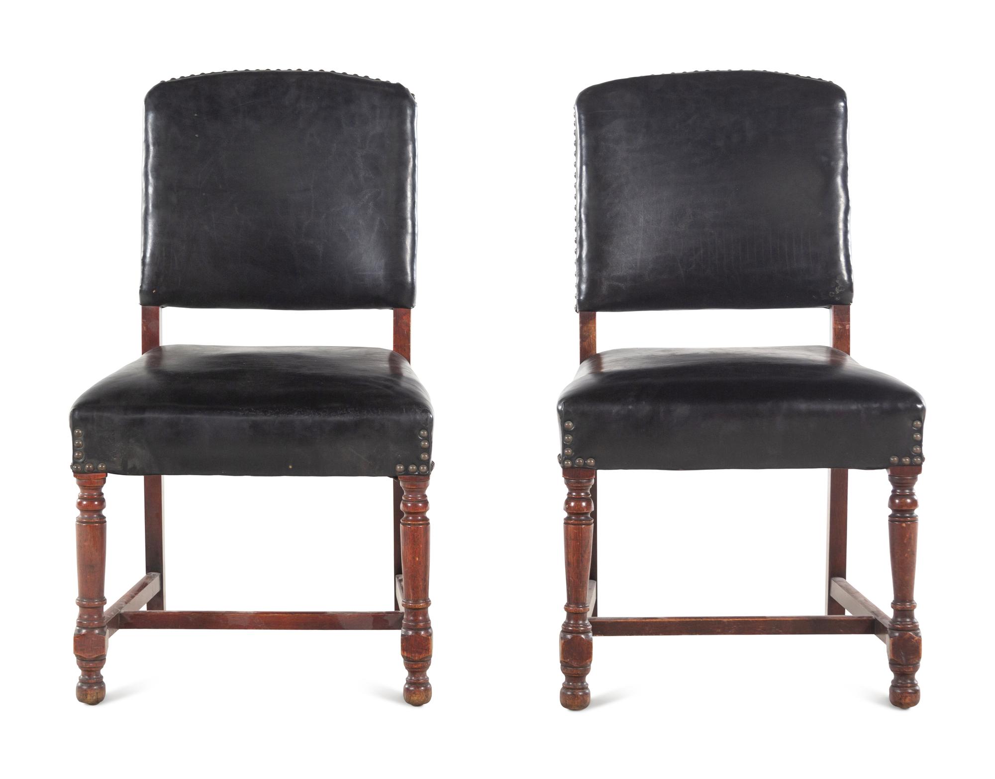 A Pair of Leather-Upholstered Side Chairs