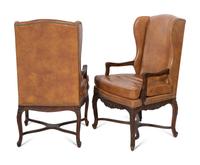 A Pair of Régence Style Leather-Upholstered Wingback Chairs