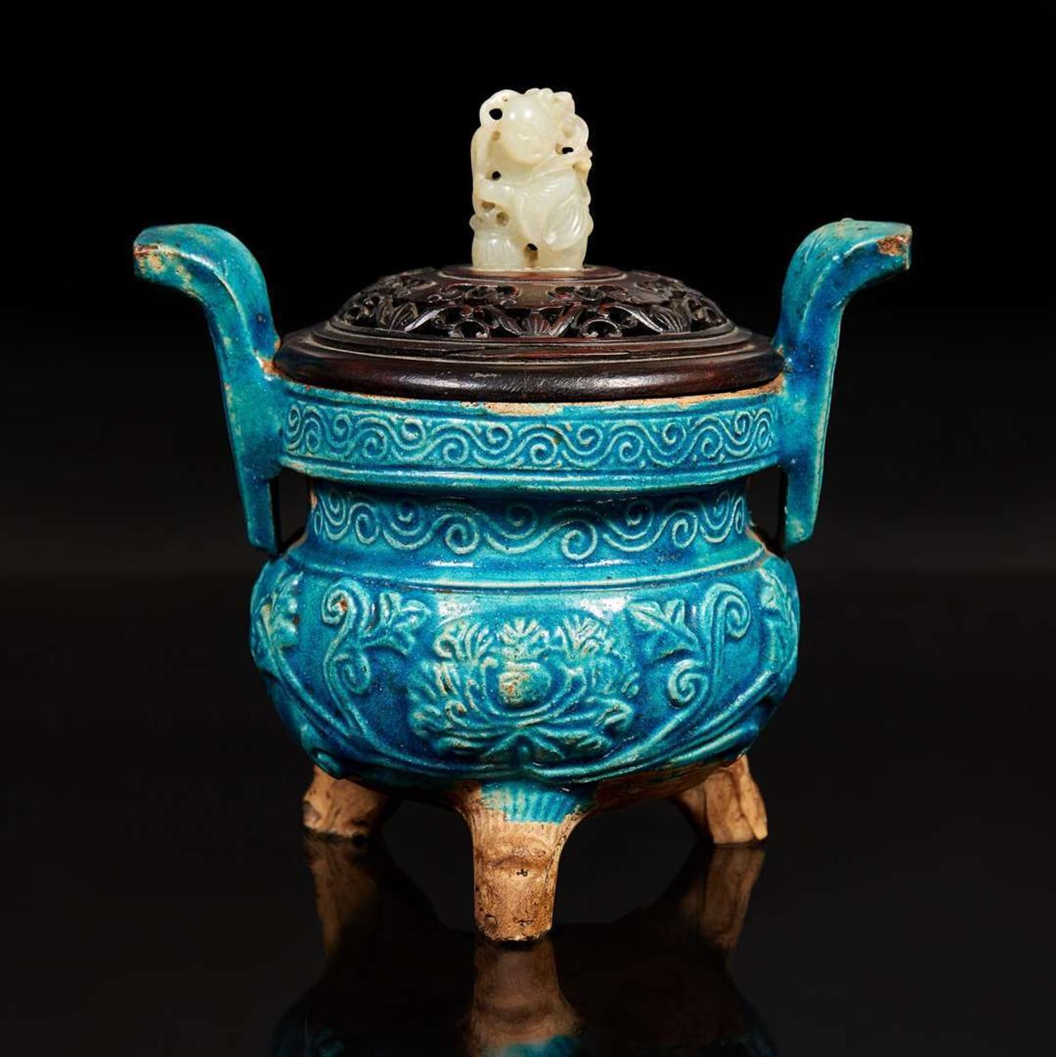 A Chinese turquoise-glazed tripod censer with carved wood cover and jade finial 松石綠地嵌玉鈕帶蓋小香爐