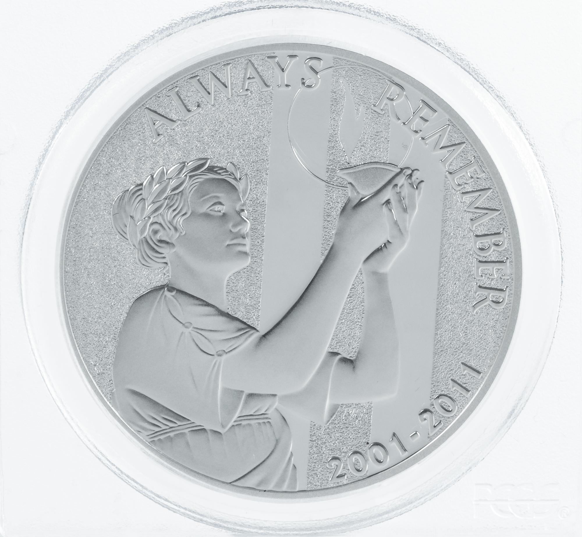 A Pair of United States 2011-W September 11, 2001 Memorial Limited Edition First Strike 1 Oz. Silver Medals