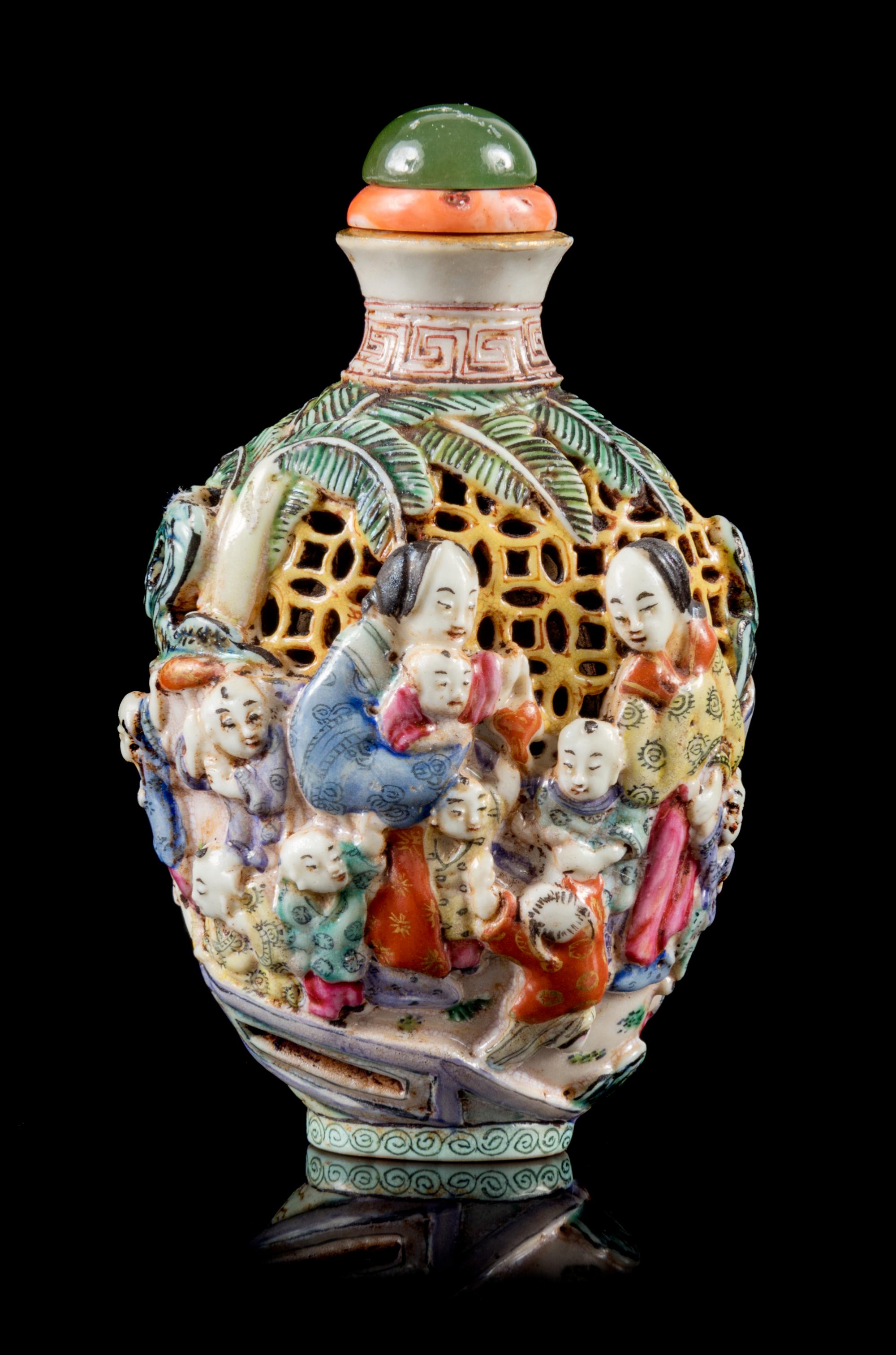 A Molded Famille Rose Porcelain Snuff Bottle Height 3 1/2 inches. — 19TH CENTURY