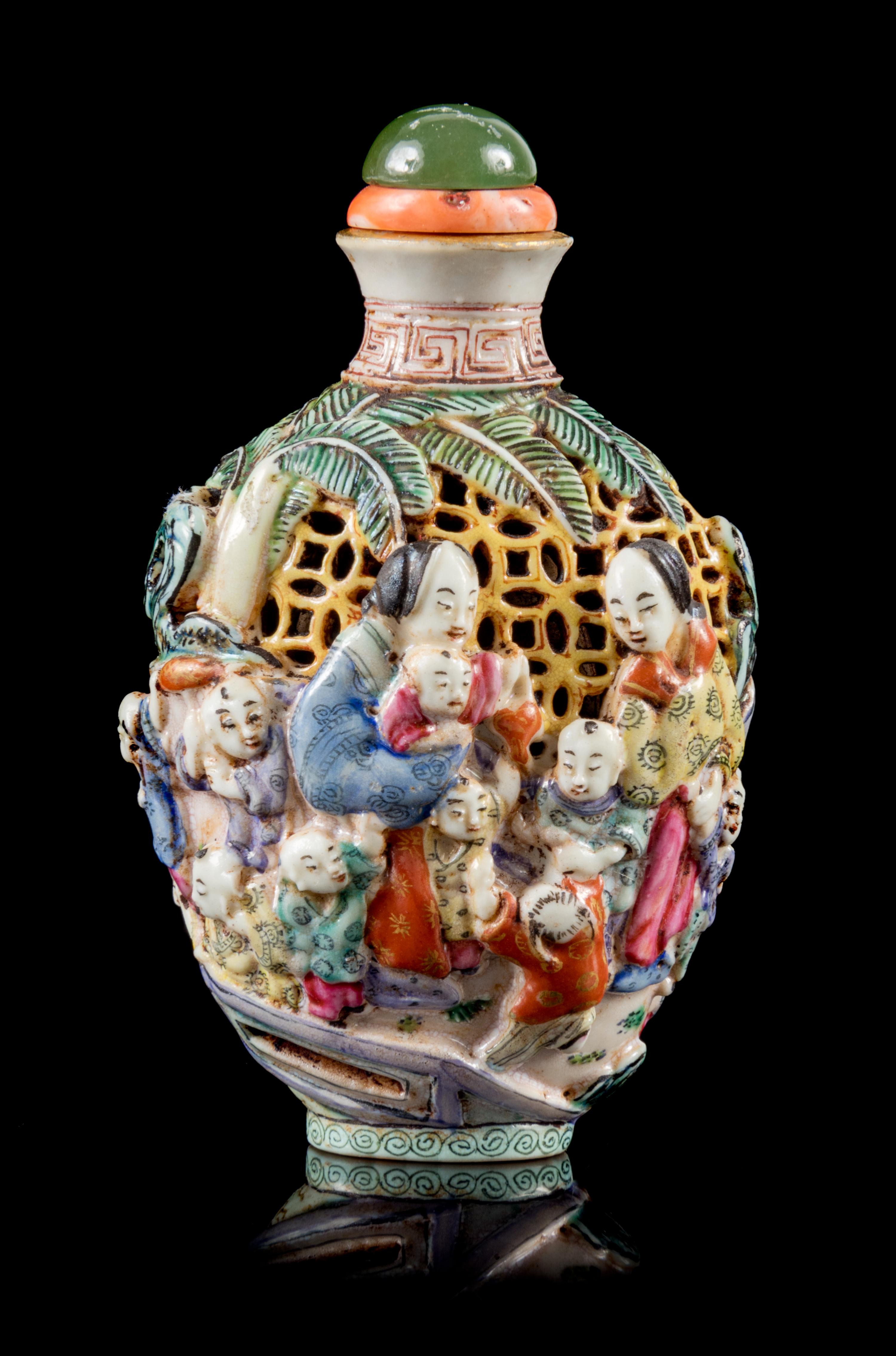 A Molded Famille Rose Porcelain Snuff Bottle Height 3 1/2 inches. — 19TH CENTURY