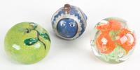 A Group of Paperweights Height of tallest 9 inches.