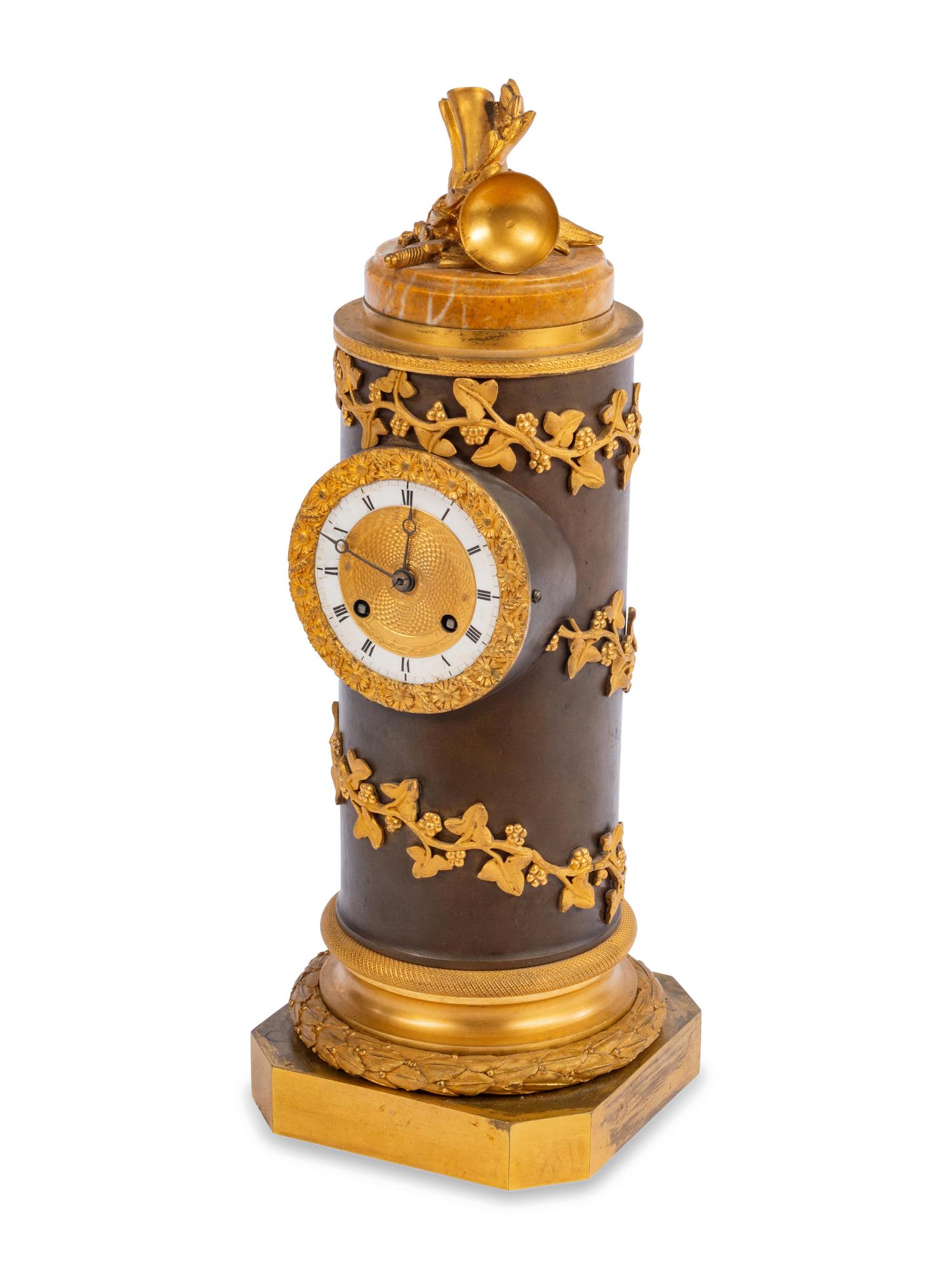 A Charles X Gilt and Patinated Bronze Cylindrical Clock