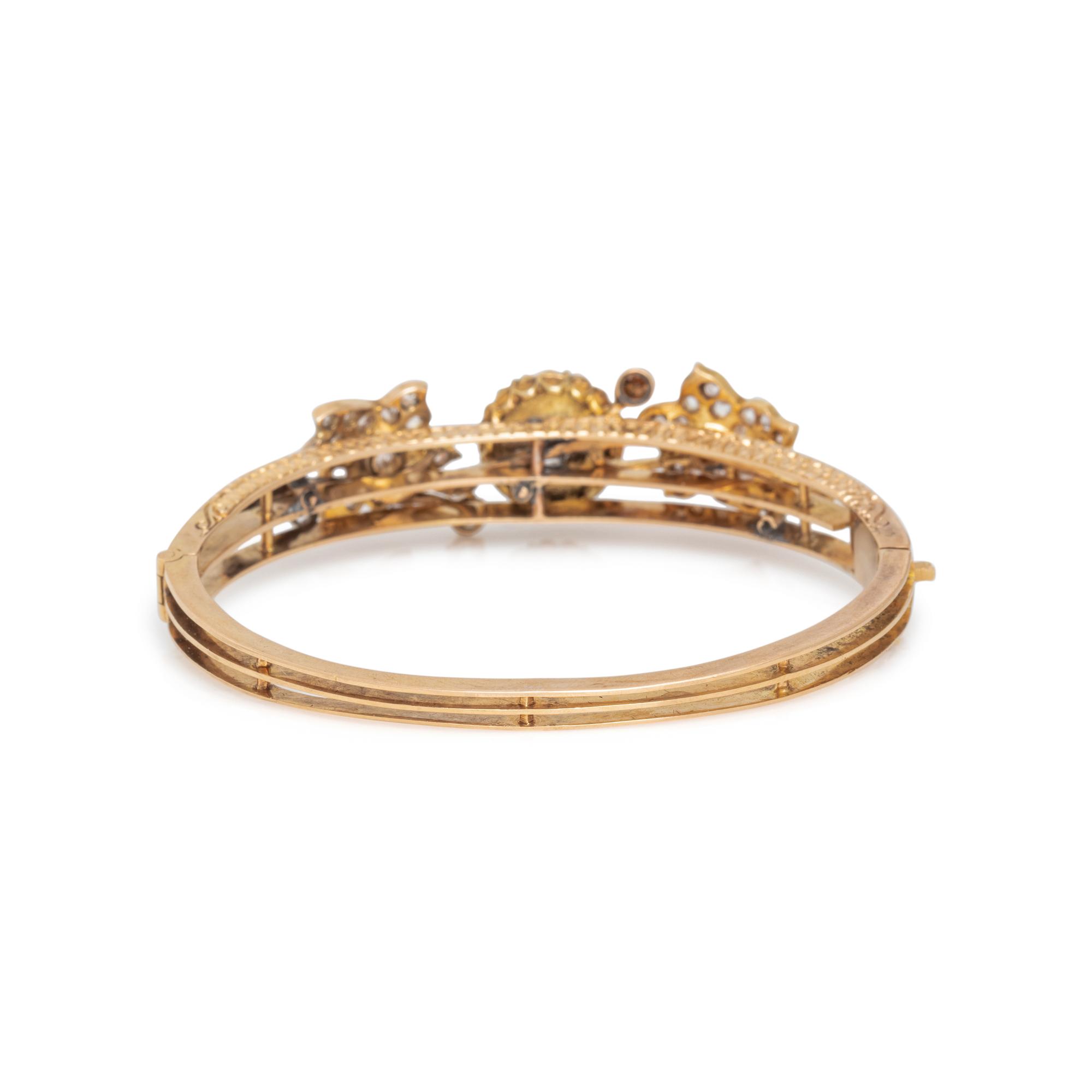 FRENCH, YELLOW GOLD AND DIAMOND BANGLE BRACELET