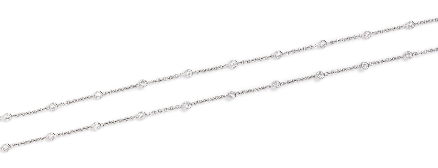 An 18 Karat White Gold and Diamond Station Necklace, 6.70 dwts.