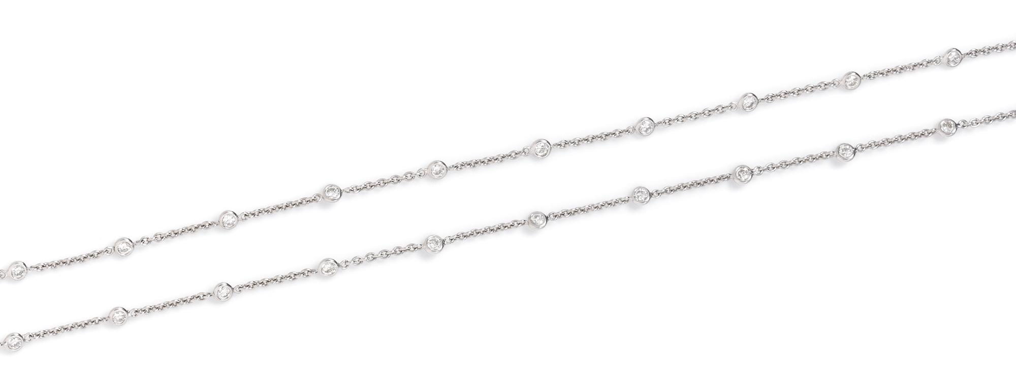 An 18 Karat White Gold and Diamond Station Necklace, 6.70 dwts.