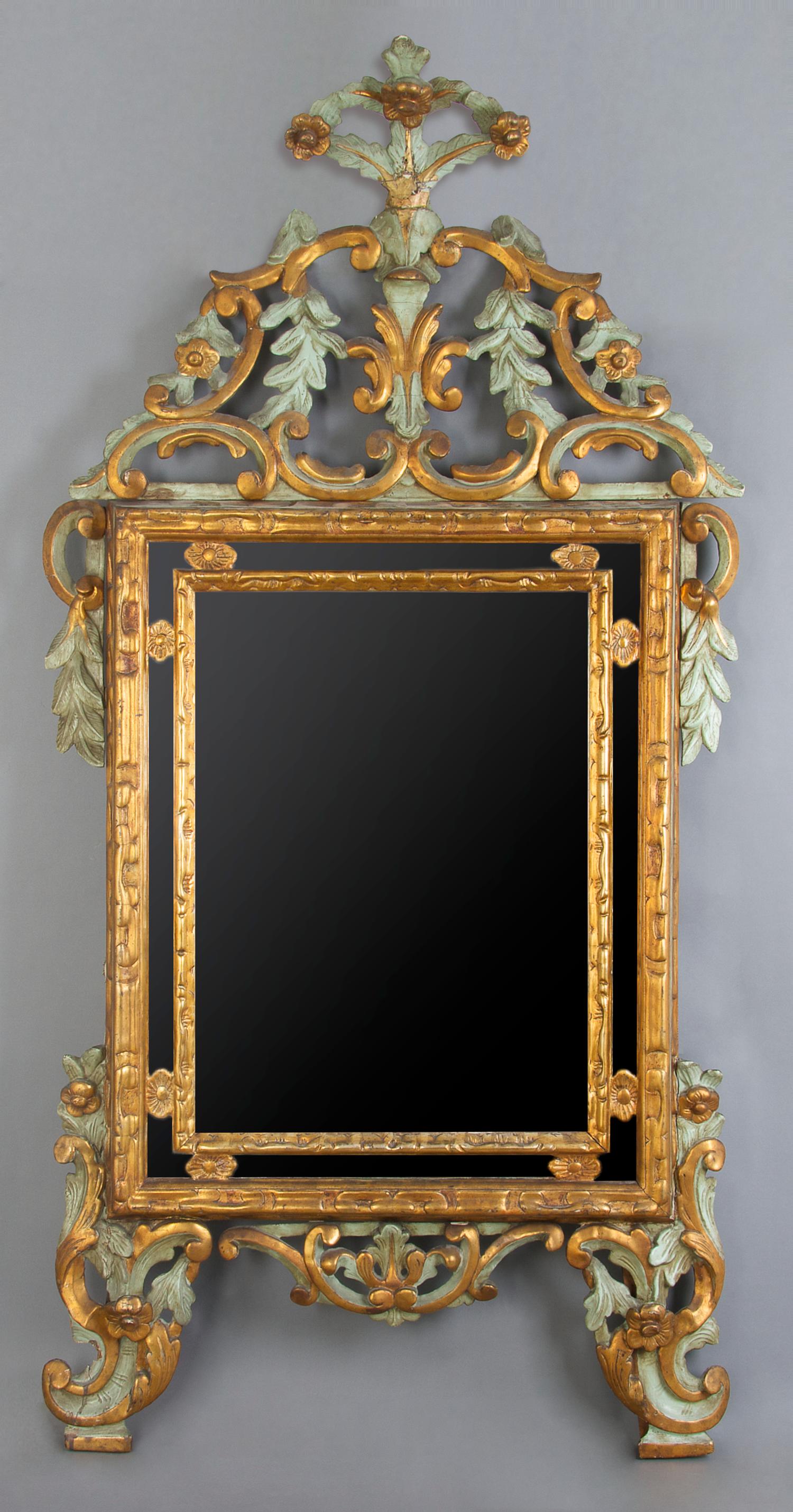 An Italian Giltwood Mirror, Height 61 x width 30 1/2 inches.