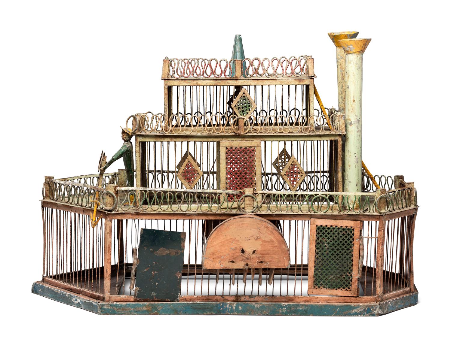 A Folk Art Cut and Painted Metal Paddleboat Form Birdcage