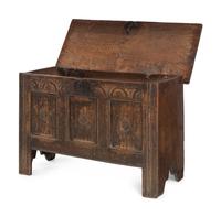 A Charles II Carved Oak Plank Chest