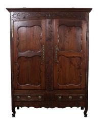 A French Relief Carved Oak Armoire Height 85 x width 61 x depth 21 inches.