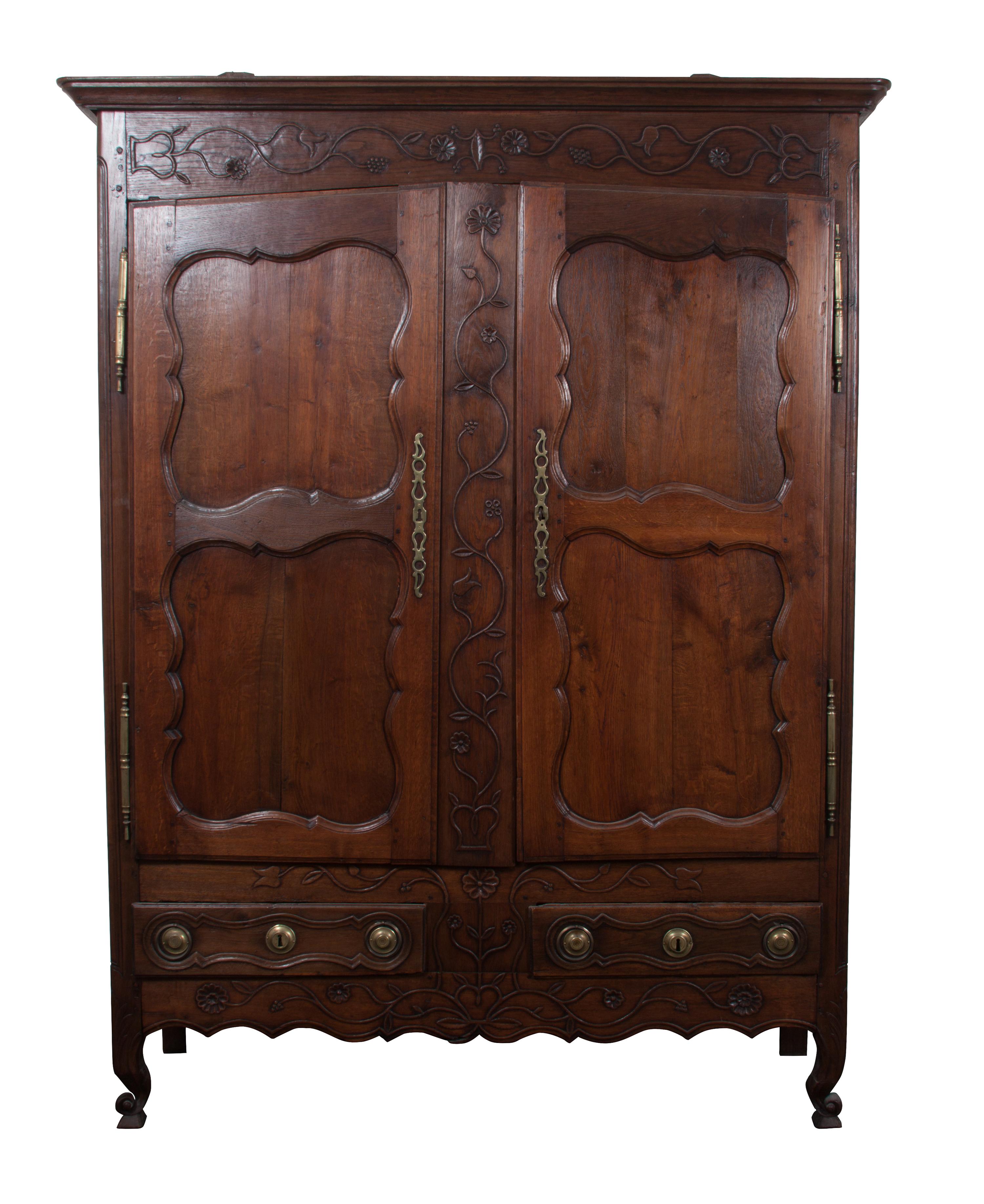 A French Relief Carved Oak Armoire Height 85 x width 61 x depth 21 inches.