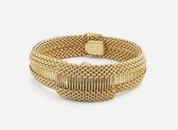 A Ladies 14K Yellow Gold Hidden Dial Watch