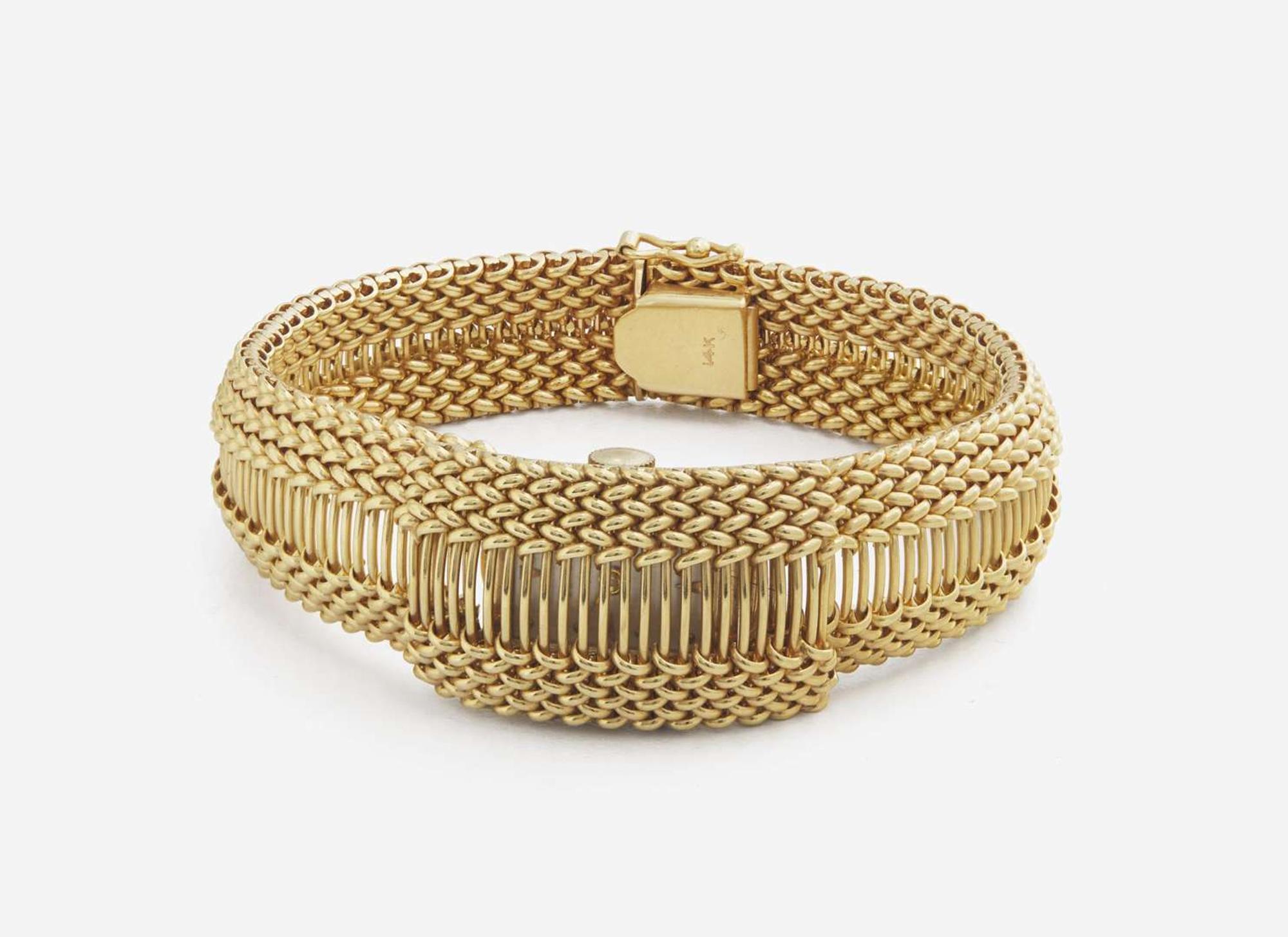 A Ladies 14K Yellow Gold Hidden Dial Watch