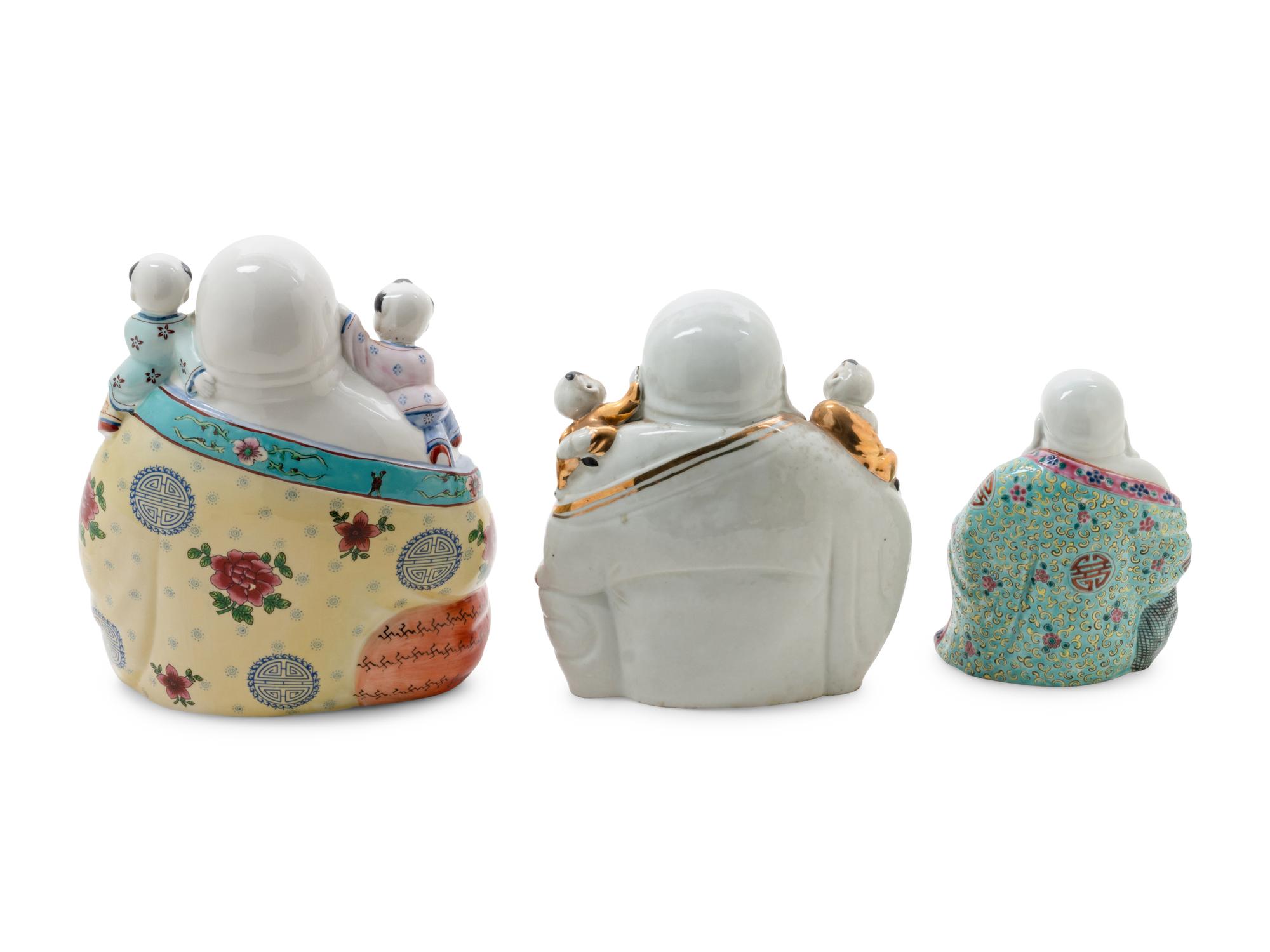 Three Famille Rose Porcelain Figures of Buddhas