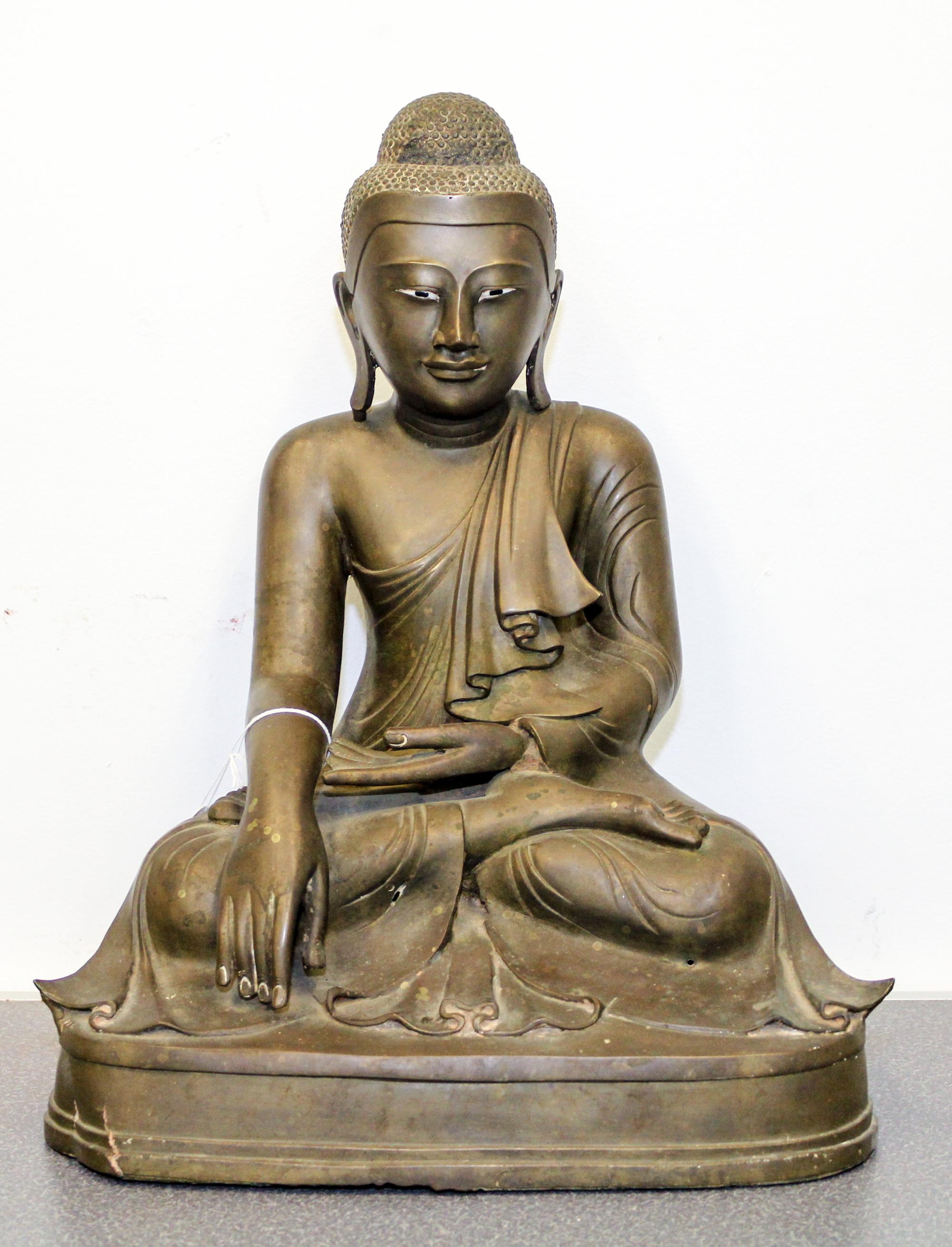 A Burmese Bronze Figure of Seated Buddha Height 18 1/2 inches.
