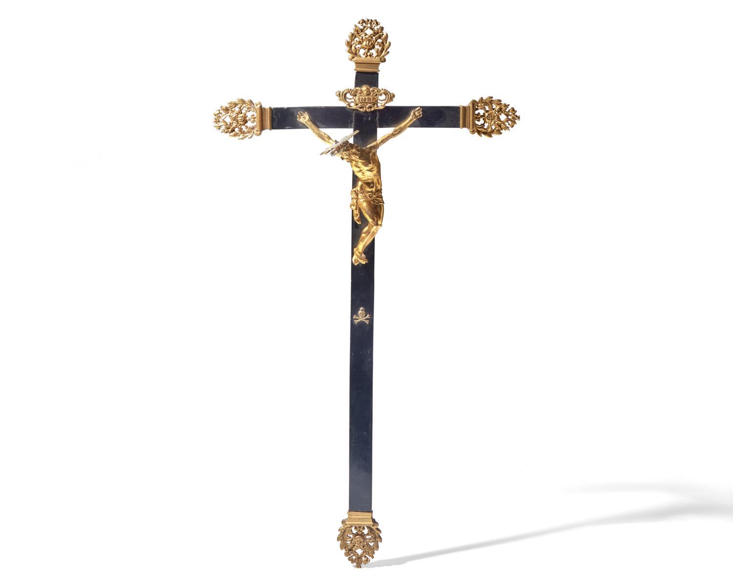 An Italian gilt bronze and ebonized wood crucifix, Naples, 17th century