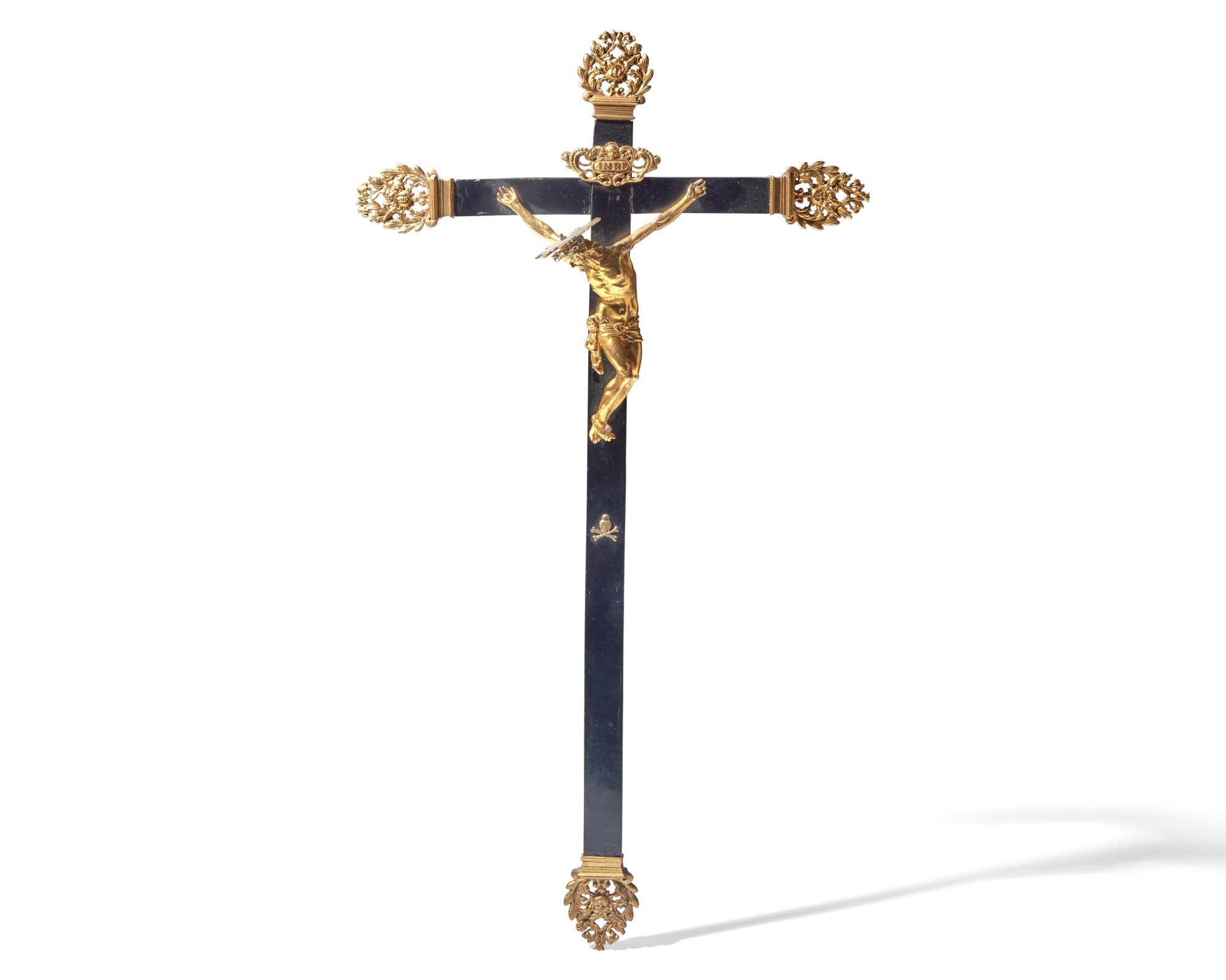 An Italian gilt bronze and ebonized wood crucifix, Naples, 17th century