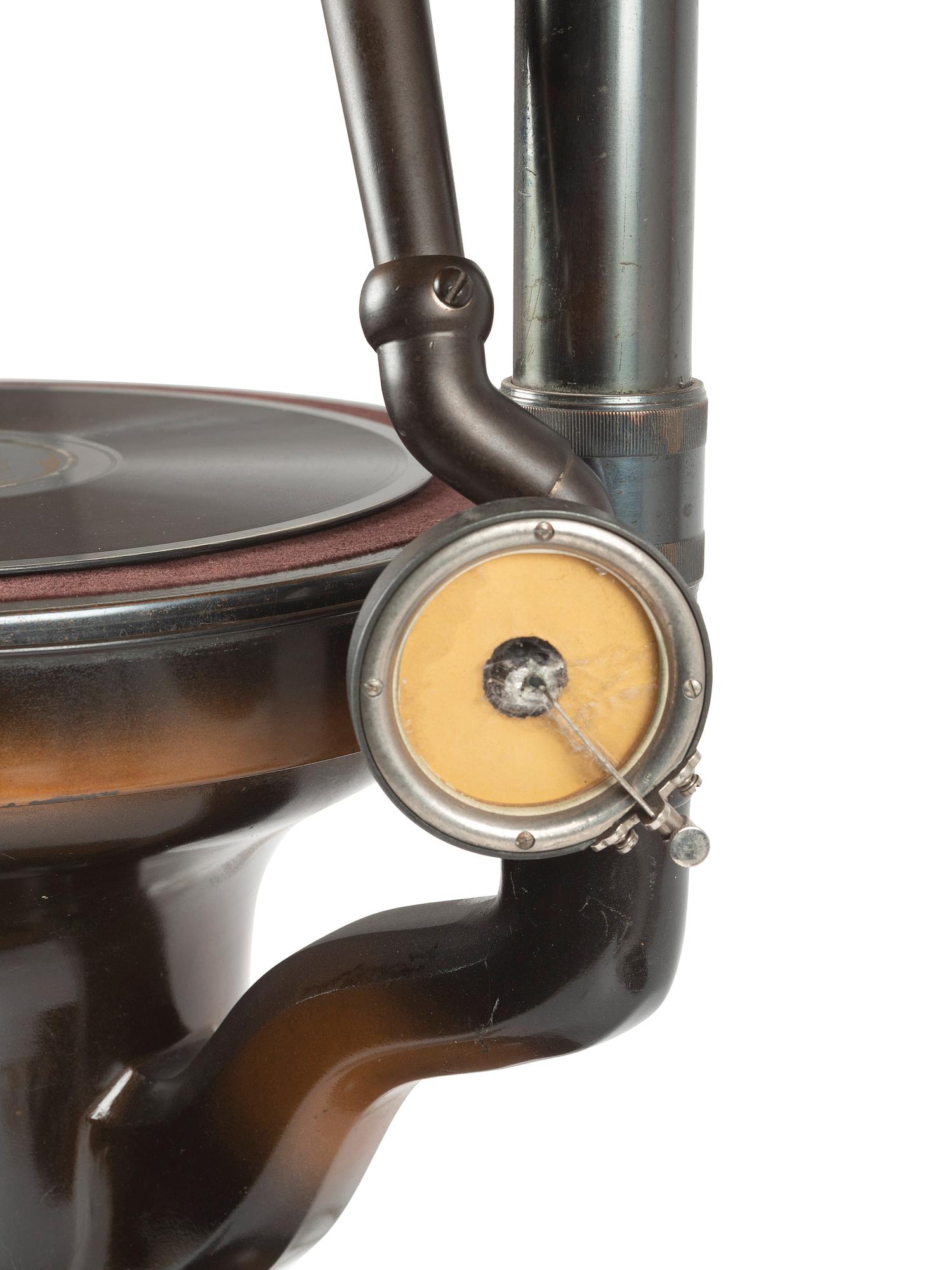 A Fairy Phonograph Patinated Metal Lamp with a Slag Glass Shade