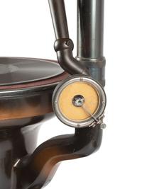 A Fairy Phonograph Patinated Metal Lamp with a Slag Glass Shade