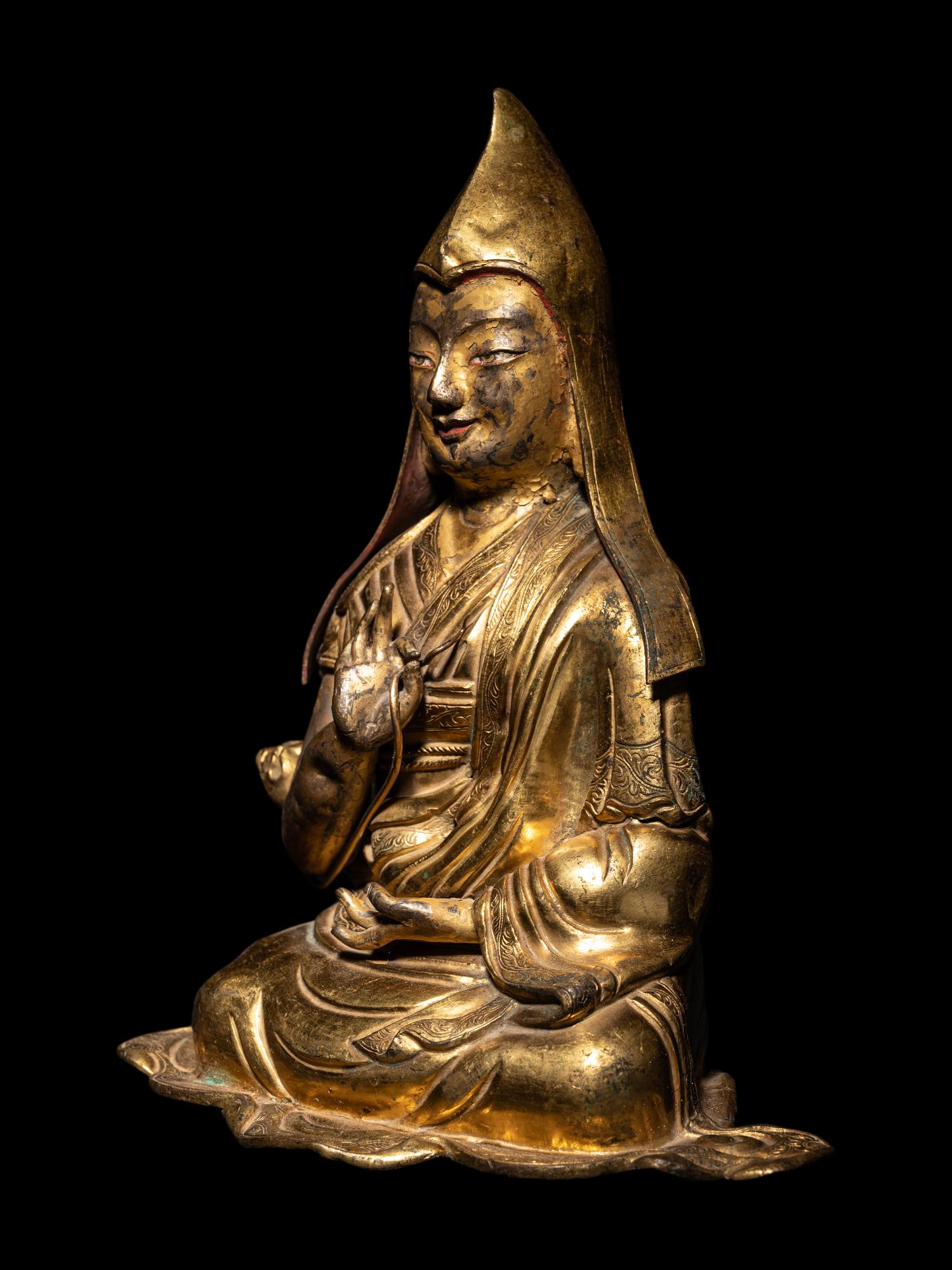 A Tibetan Gilt Bronze Repoussé Seated Figure of Tsongkhapa